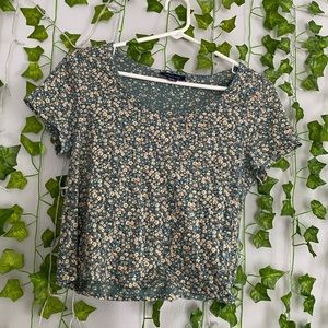 Green top with a floral design